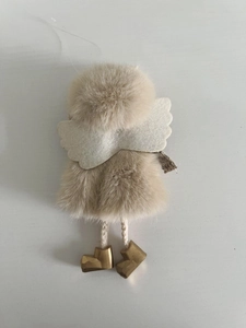 Detail showing plush Christmas angel ornament with felt wings and golden boots