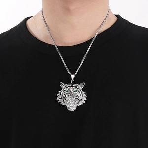 Hip hop silver tiger head pendant necklace with clear crystals and green eyes on a model
