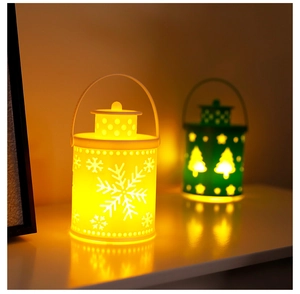 Detail of warm glow Christmas lantern with snowflake cutout on a cozy tabletop