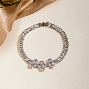 Macro view of silver bracelet with rectangular crystals and triple star cluster details