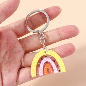Handheld acrylic rainbow keychain with geometric star patterns and silver ring