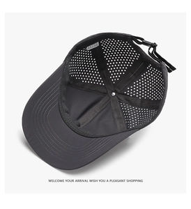 Detail of dark grey breathable mesh baseball cap with laser-cut holes and adjustable strap