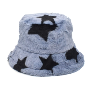 Detailed texture of blue plush bucket hat featuring black star patterns for winter warmth