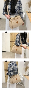Three-way view of khaki nylon crossbody bag showing size and adjustable strap on a model