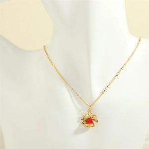 Detail of a Christmas bell pendant necklace with red enamel and micro-inlaid colorful zircons