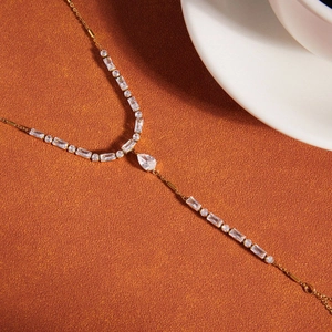 Elegant gold stainless steel hand bracelet with pear-cut zircon and geometric stones