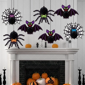 7-piece set of Halloween spider and bat honeycomb paper ornaments hanging above a fireplace