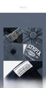 Detail view of navy corduroy baseball cap with metal buckle and embroidered logo