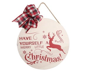 Close-up of wooden Christmas sign with reindeer silhouette and red buffalo plaid bow