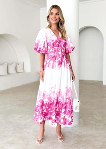Detail of V-neck puff sleeve dress featuring pink floral print and high waist A-line design