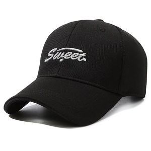 Classic black cotton baseball cap featuring white Sweet embroidery in a 45-degree view