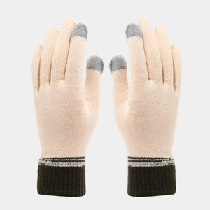 Detail of beige knit gloves with touchscreen fingertips and striped cuffs for winter