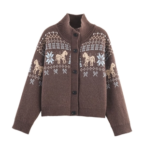 Detailed knit texture of brown cardigan with jacquard horse and snowflake patterns