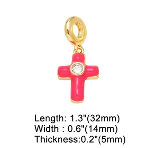 Detail view of pink enamel cross pendant with zircon center and exact dimensions