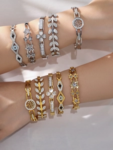 Detail of luxury clover and tree of life bracelets set with premium 5A zircon stones