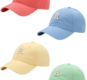 Close-up showing a matrix of cotton baseball caps in pastel pink, blue, yellow and green
