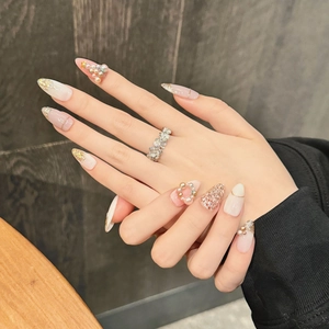 3D Christmas nail set with pearl rhinestones and gold French glitter on almond nails