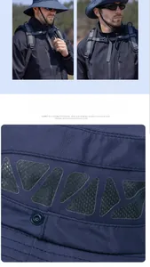 Detail view of breathable mesh and fabric texture on dark blue outdoor sun hat for men