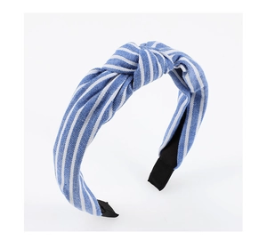 Detailed close-up of blue and white striped knotted headband with comfortable black ends