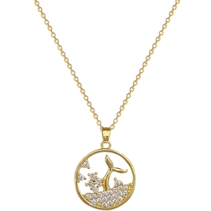 Elegant gold whale tail necklace with sparkling zircon waves on white background