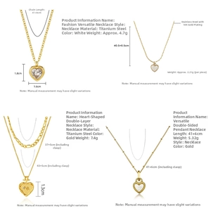 Macro detail of 18K gold-plated stainless steel heart necklaces with white mother of pearl