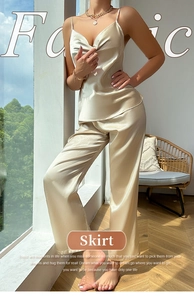 Detail of silk satin camisole and wide-leg pants set in elegant champagne gold color