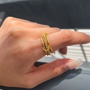 Detail of 18K gold-plated stainless steel multi-layered ring with sparkling zircon stones