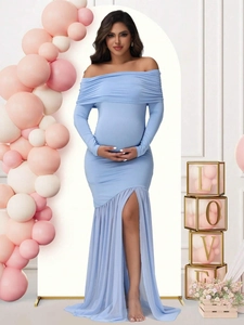 Detail of sky blue off-shoulder maternity gown with mesh hem and side slit design