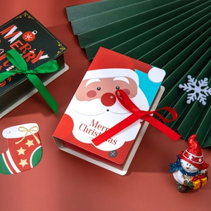 Creative Christmas magic book candy boxes with festive ribbons and Santa Claus patterns