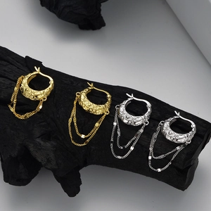 S925 silver lava texture chain earrings in gold and silver finish on black wood