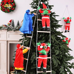 Three Kings Christmas climbing ladder figurines hanging on a tree near fireplace