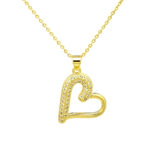 Macro detail of a gold heart pendant with micro-pave white cubic zirconia on a cross chain