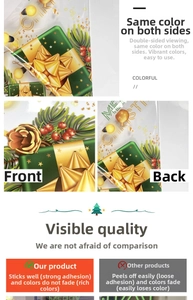 Close-up of double-sided Christmas window stickers with gold gifts and pine berry patterns