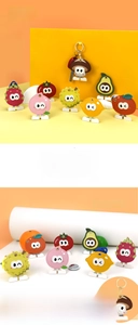 Detailed view of assorted cartoon fruit PU leather access card holders with keyrings