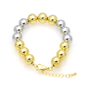 Detail of 18k gold and silver beaded bracelet featuring lobster clasp and extension chain