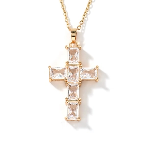 Golden cross necklace for women featuring sparkling cubic zirconia crystals on white background