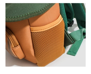 Close-up of durable canvas backpack featuring side elastic mesh pocket and reinforced seams