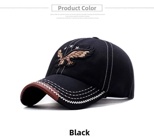 Detail of baseball cap showing eagle embroidery, contrast stitching and brown leather trim