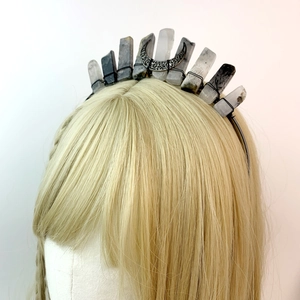 Detail of handmade crown headband with natural crystals and a carved metal triple moon
