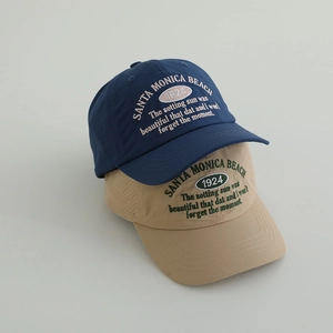 Close-up of embroidered Santa Monica Beach logo and breathable vents on baseball caps