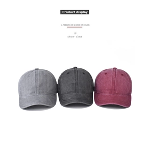 Short brim washed baseball caps in grey, black, and burgundy with vintage cotton texture