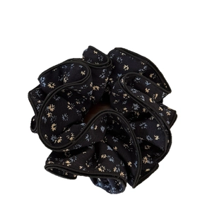 Navy floral four-layer oversized fabric scrunchie with yellow and blue flower patterns