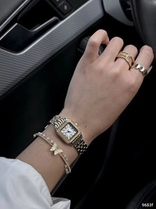 Gold square watch with diamond bezel paired with pearl bracelet and rings set