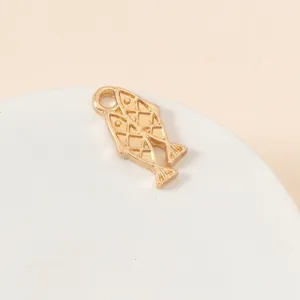 Detailed view of a gold-plated double fish pendant with intricate textured patterns