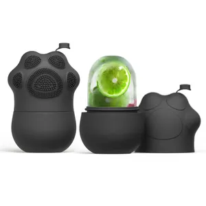 Matte black cat paw silicone ice face roller showing closed and open parts with lime