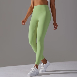 Close-up of high-waisted avocado green yoga leggings featuring high-stretch fabric texture