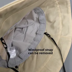 Detail view of the beige sun hat interior with breathable mesh lining and size L tag