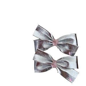 Silver bow hair clips set with pink heart accents for girls and toddlers