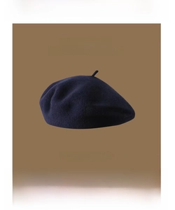 Detail of wool beret texture in navy blue with UNCLE STUBBLE branding for 2022AW