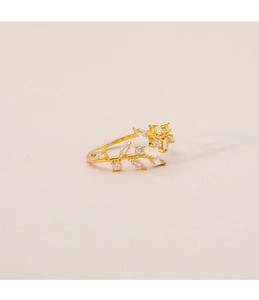 Detail of leaf-shaped open ring in gold finish with micro-set shimmering crystals